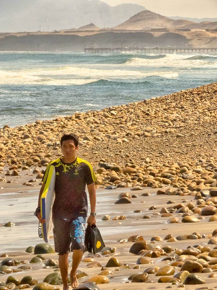 Body Boarder walking to the surf spot.