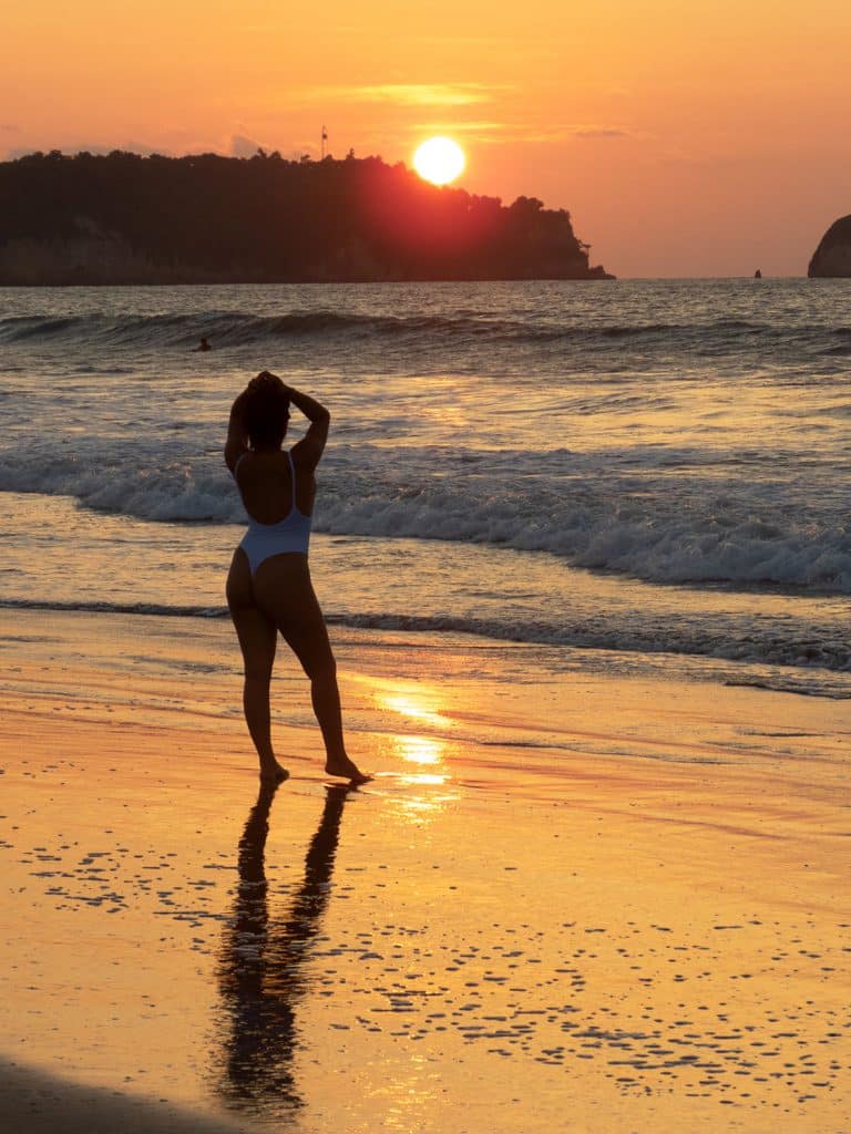 Beautiful woman on the beach sunset in Ecuador