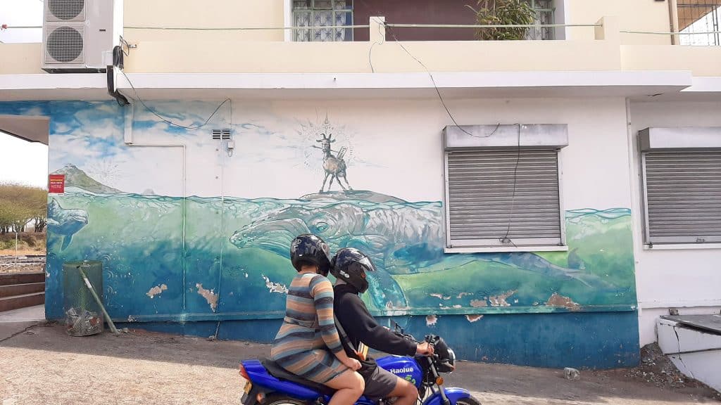 Street Art Mural of a Goat riding a Whale