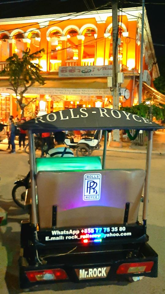 A tuk-tuk with humorous Rolls-Royce branding